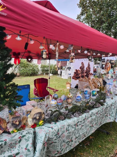 Festive artisan vendor stall at the Candlelight Christmas Market in Jefferson, Texas