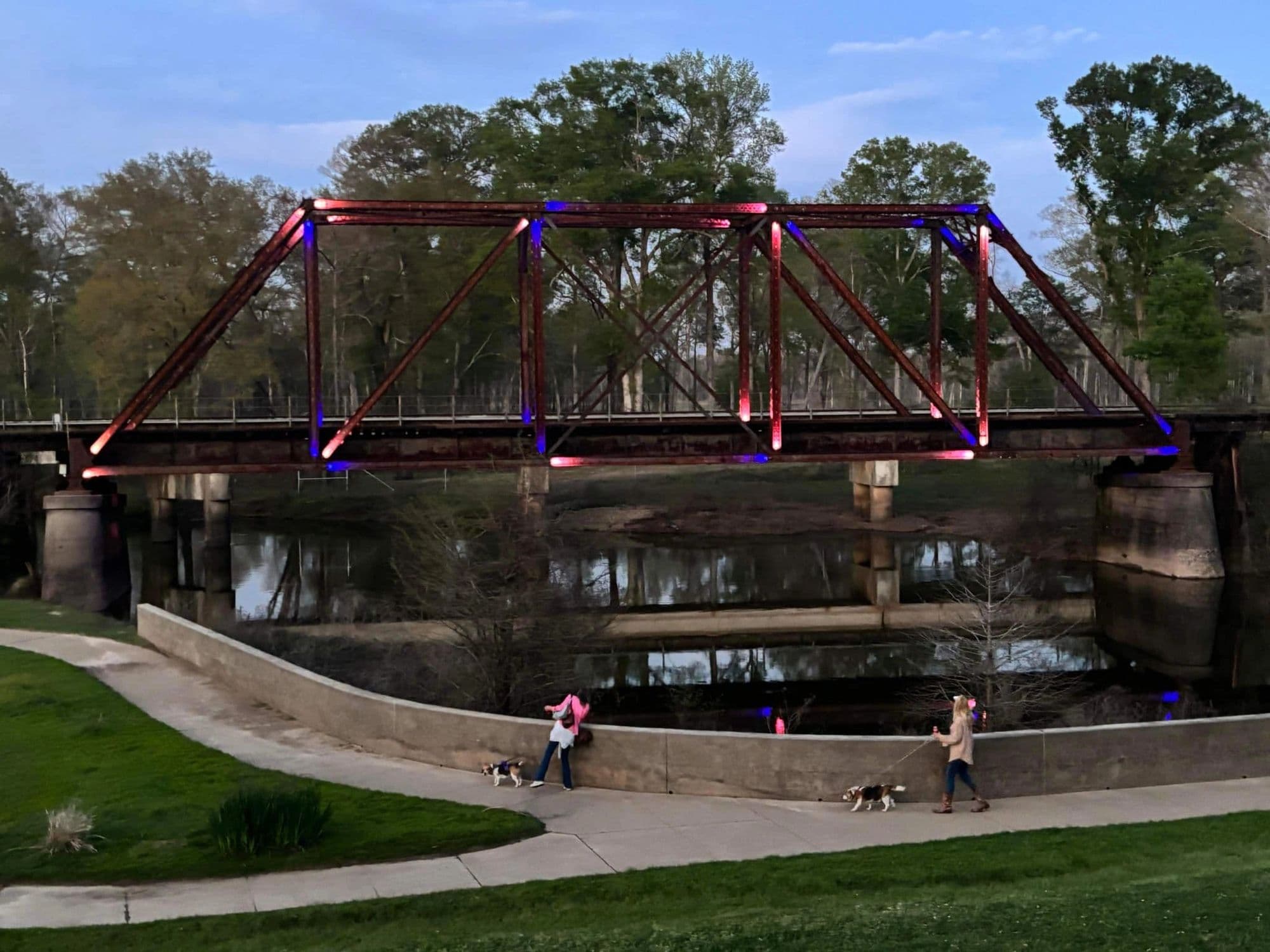 Historic bridge and spring greenery beside Big Cypress Bayou in Jefferson